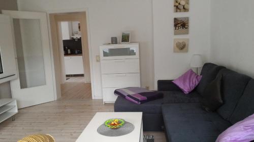 a living room with a couch and a table at Ferienwohnung Jesper in Braunlage