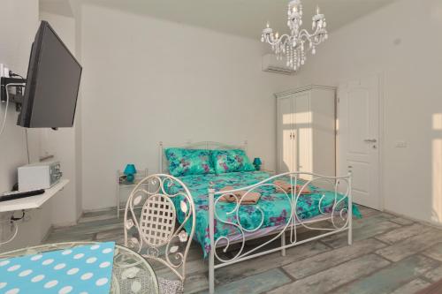 a bedroom with a bed and a desk at Main Square Apartments in Pula