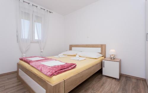 Ένα ή περισσότερα κρεβάτια σε δωμάτιο στο Apartment's Đordić