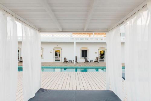 a view of the pool from the house at Conversas de Alpendre in Vila Nova de Cacela