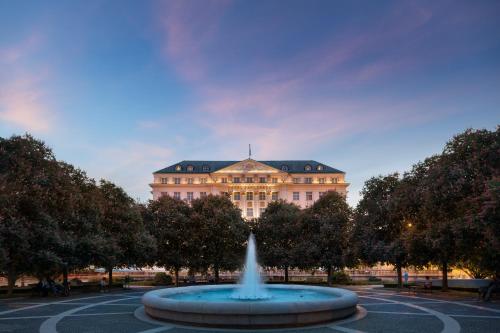 a fountain with a large clock on top of it at Esplanade Zagreb Hotel in Zagreb