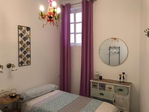 Posteľ alebo postele v izbe v ubytovaní Apartamento Aromas del Mercado