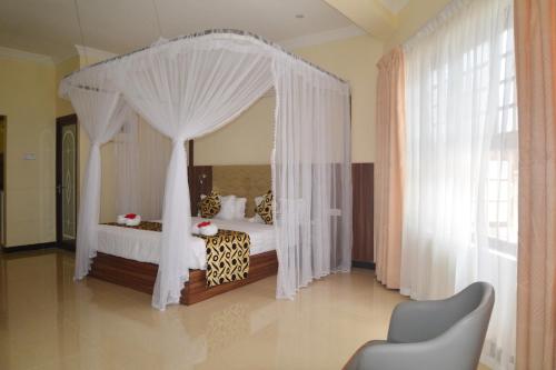 Katil atau katil-katil dalam bilik di Spice Palace Hotel