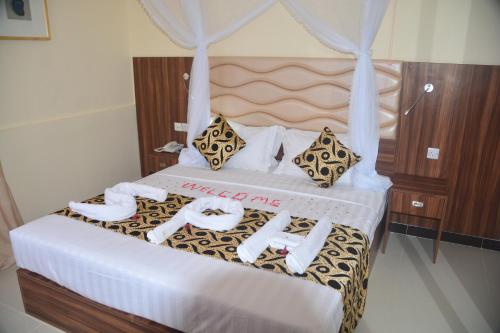 Katil atau katil-katil dalam bilik di Spice Palace Hotel