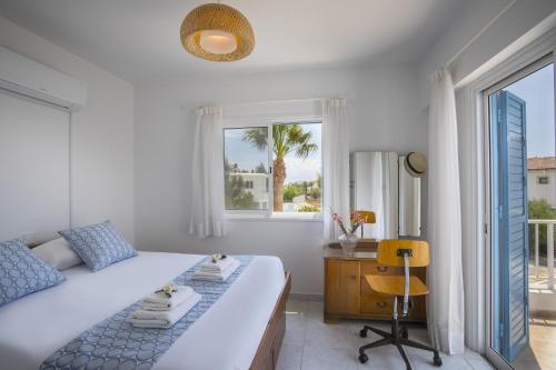 Ένα ή περισσότερα κρεβάτια σε δωμάτιο στο Villa Serene