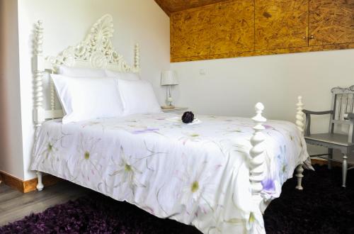 Postel nebo postele na pokoji v ubytování Casa do Azevinho - Grupo Casas Vale do Lima