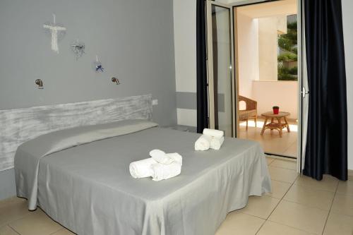 Postel nebo postele na pokoji v ubytování Hotel La Punta