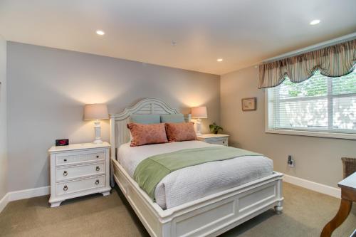 a bedroom with a white bed and a window at Winchester Inn in Ashland