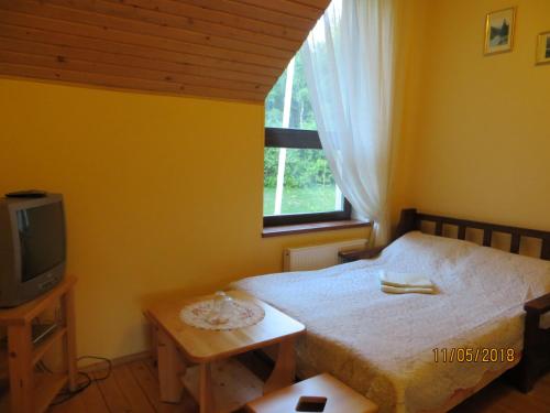 Un pat sau paturi într-o cameră la Yalivets