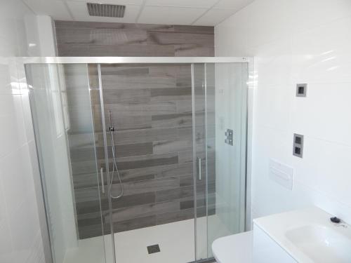 a bathroom with a shower and a toilet and a sink at Hostal Boutique Doña Carmen - Adults Recommended in Nerja