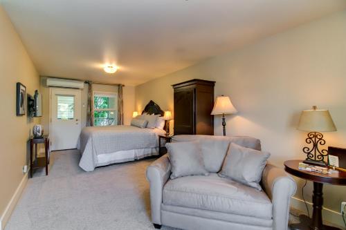 a living room with a bed and a couch and a bed at Winchester Inn in Ashland