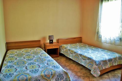 En eller flere senge i et værelse på Ktima Elia