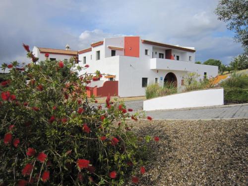 a view of a house from the garden at Hotel Sindhura in Vejer de la Frontera