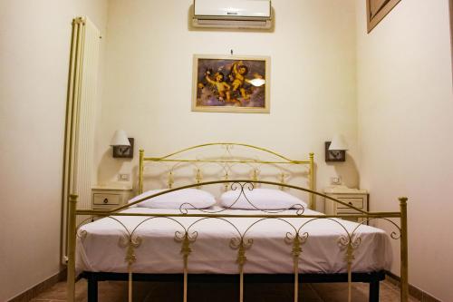 A bed or beds in a room at Ricciolandia Suites