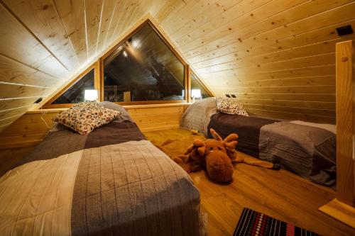 Posteľ alebo postele v izbe v ubytovaní Domki Tatrzański Ogród Regional Houses Zakopane