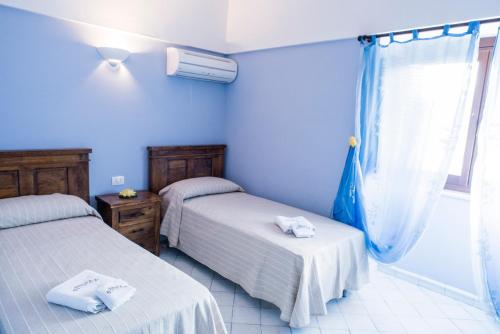 Postel nebo postele na pokoji v ubytování Dammusi Sotto le Stelle