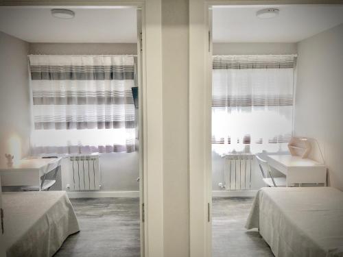 Postel nebo postele na pokoji v ubytování Plaza 5 Carabanchel Apartment