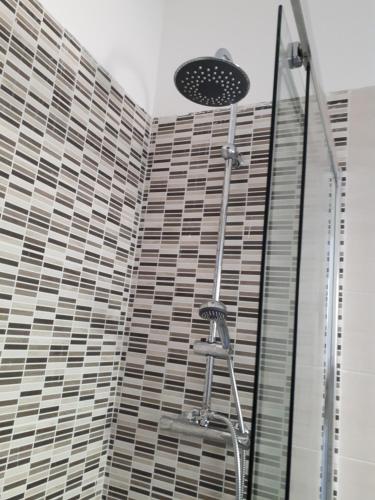 a shower in a bathroom with a glass wall at Le camere di Sabrina con bagno in camera in Sarzana