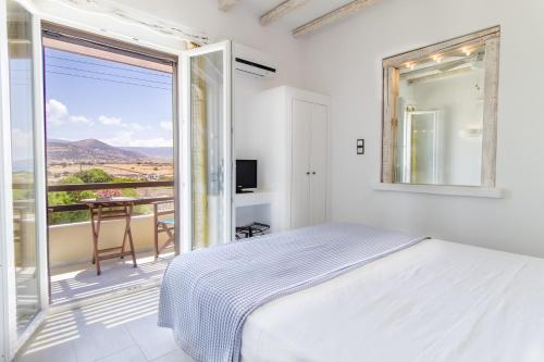 Ένα ή περισσότερα κρεβάτια σε δωμάτιο στο Villa Faros Luxury Apartments & Suites