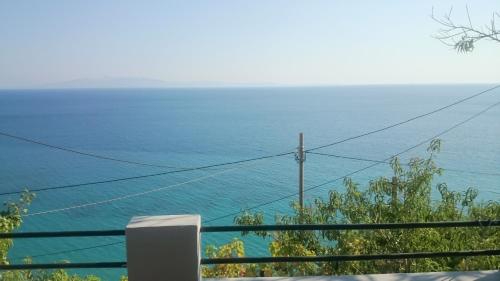a view of the ocean from a balcony at Blue View in Qeparo