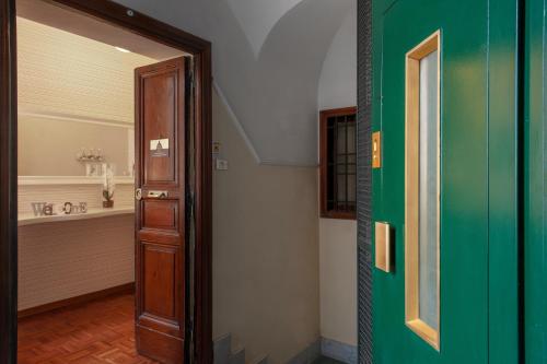 an open door to a room with a bathroom at Arie Romane Guesthouse in Rome
