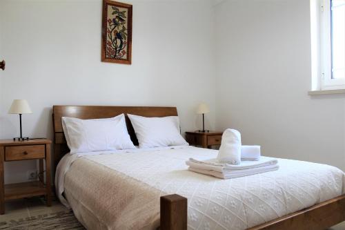 A bed or beds in a room at Casa da Maria Moca