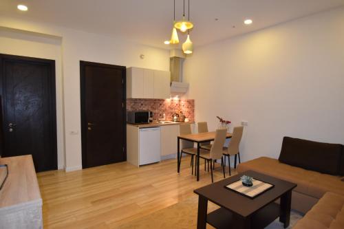 a living room with a couch and a table at SaBa Apartments in Old Tbilisi in Tbilisi City