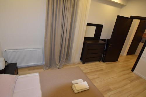 a room with a bed and a dresser and a mirror at SaBa Apartments in Old Tbilisi in Tbilisi City