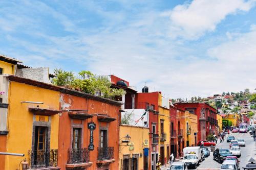 a view of a city street with cars parked at Casa Relox 23 in San Miguel de Allende