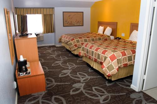 a hotel room with two beds and a window at Keefers Inn King City in King City