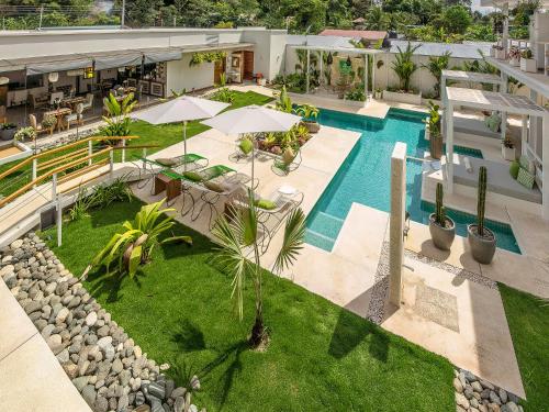an overhead view of a pool at a hotel at Umami Hotel - Adults Only in Puerto Viejo