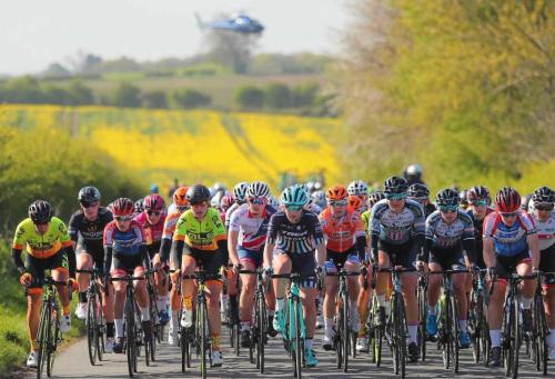 a group of people riding bikes on a road at OurHaus in Beverley