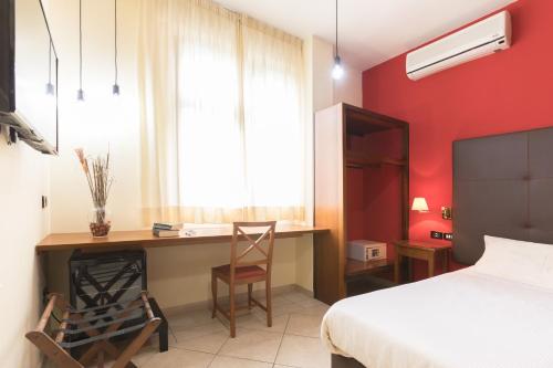 Un ou plusieurs lits dans un hébergement de l'établissement Hotel La Baia