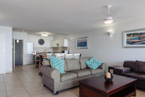 a living room with a couch and a table at Suntrap 6 - FAMILY ONLY in Ballito