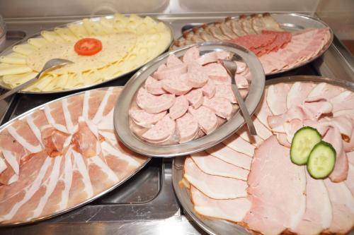 a bunch of different types of meats and cheese at Gasthaus und Landhotel Wiedmann in Eresing