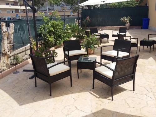 a group of chairs and tables on a patio at BELLAVISTA B&b in Lamezia Terme