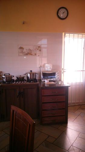 a kitchen with pots and pans on a counter at Villa Victoria in Trou dʼ Eau Douce