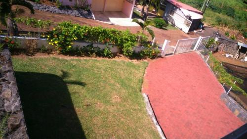 an aerial view of a yard with a red carpet at Villa Victoria in Trou dʼ Eau Douce