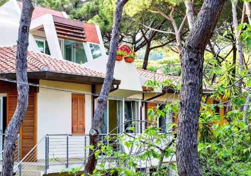 a house with a flower box on the side of it at Lara Elite in Castiglione della Pescaia