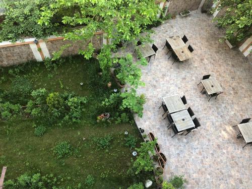an overhead view of tables and chairs in a garden at Ottoman Palace Hotel Edirne in Edirne