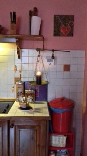 a kitchen with pink walls and a counter top at BARDONECCHIA SCI E RELAX in Bardonecchia