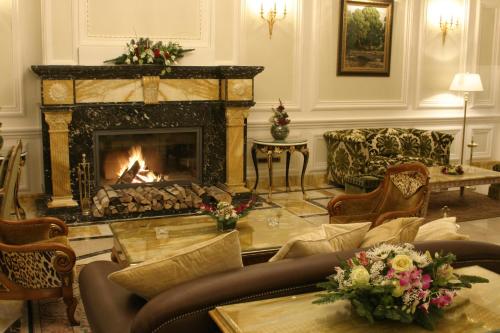 a living room filled with furniture and a fire place at Savoy in Moscow
