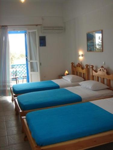 Ένα ή περισσότερα κρεβάτια σε δωμάτιο στο Karabo Hotel