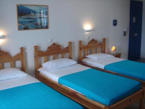 Ένα ή περισσότερα κρεβάτια σε δωμάτιο στο Karabo Hotel