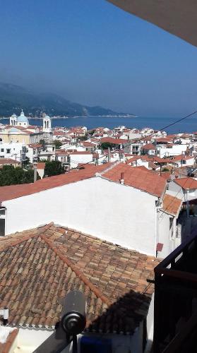 a view of a city from the roof of a building at Green Hill Studios & Apartments in Kokkari