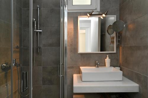 a bathroom with a sink and a shower at Efi Studios in Drios
