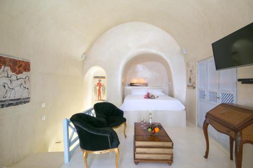 Ένα ή περισσότερα κρεβάτια σε δωμάτιο στο Kastro Oia Houses