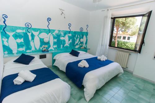 Un pat sau paturi într-o cameră la Hotel Punto Verde