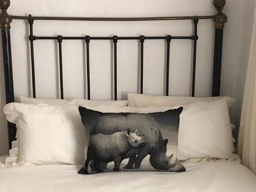 a bear and cub pillow on a bed at Kromrivier Farm Stays & B&B Near Addo Elephant Park in Paterson