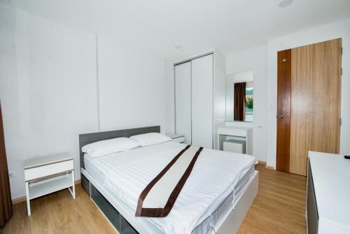 Łóżko lub łóżka w pokoju w obiekcie Ozone Apartments
